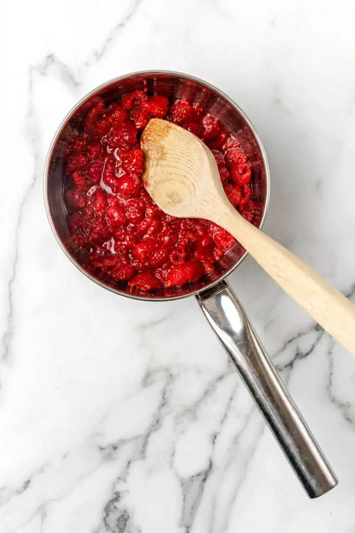 4 Easy Raspberry Sauce Recipes For Every Sweet Tooth 4 4 Easy Raspberry Sauce Recipes, Step 1: Cook The Raspberries