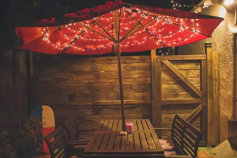 20 String Light Ideas To Create A Cozy Backyard Retreat 13 20 String Light Ideas, 8. Put The Dinner Table Under The Lights